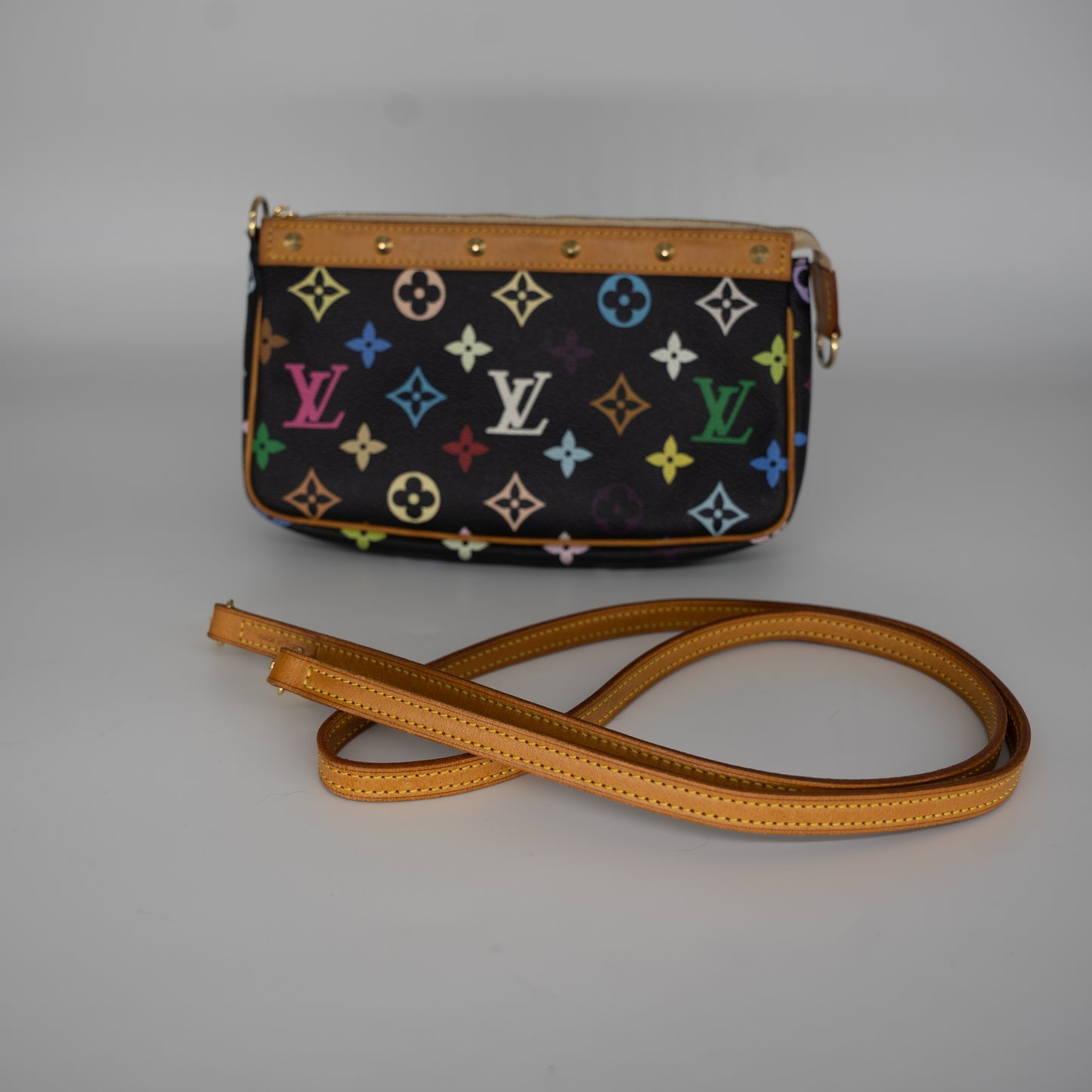 Louis Vuitton Pochette with crossbody strap.